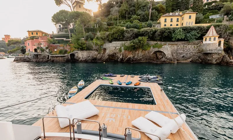 Isabell Princess of the Sea: Floating sea pool with paddleboards and water toys beside the yacht stern near a coast