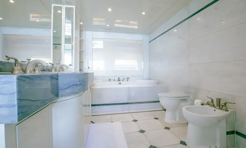 Indiana: Marble bathroom with blue stone vanity, bathtub, toilet and bidet