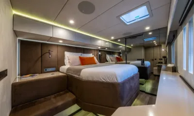 YGO: Cabin with double bed, orange cushion, mirrored wall and overhead hatch
