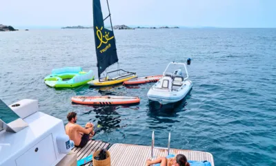 Saideira: Inflatable lounger, small sailing board, paddleboards and tender floating behind the swim platform